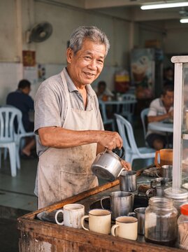 Coffee Shop Vendor Preparing Morning Orders