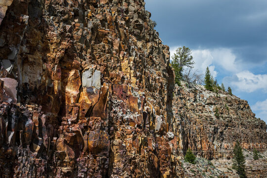 Fractured rock cliff wall along the Grand Loop Road to Kingman Pass, The Golden Gate area, traveling in Yellowstone National Park for summer vacation
