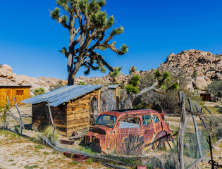 Vintage Abandoned Cars Used as Chicken Coop at The Historic Keys Ranch, Joshua Tree National Park, California, USA © Billy McDonald