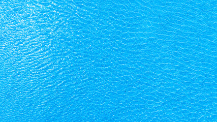 Obraz premium Top view of deep blue sea water surface with small ripples, aerial drone shot of turquoise ocean texture at island , abstract nature background 