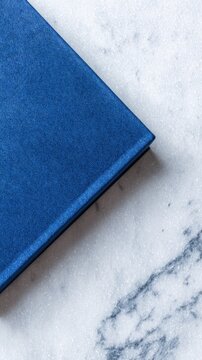 Blue book on a textured background