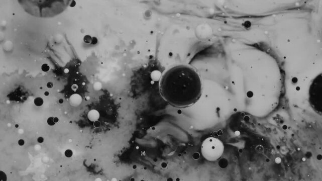 Ink paint ball cells exploding on a macro close up footage making a beautiful abstract background. Stunning Acrylic Fluid Pouring art. Concept of galaxy, space, change, blood cells, film, sci fi.