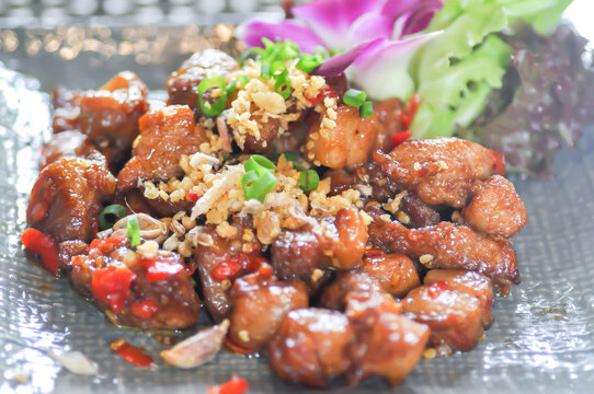 stir fried pork or deep fried pork , stir fried pork with garlic and chili