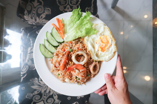 fried rice or stir-fried rice with shrimp , squid and fried egg or sunny side up egg