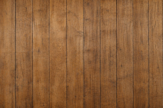 Natural teak slatted wood texture with warm brown tones, visible grain, and evenly spaced lines, ideal for furniture, wall panels, flooring, and interior design backgrounds.