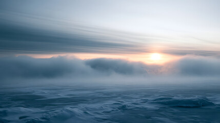 Fototapeta premium Dense Polar Fog Rolling Over a Frozen Sea Under a Faint Sun at Dawn in an Icy Landscape