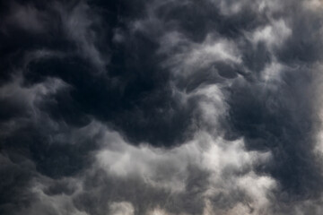 Fototapeta premium Dramatic dark storm clouds gathering in the sky overhead