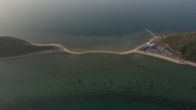 Aerial view of Diep Son Islands in Van Phong Bay, Van Thang Commune, Khanh Hoa, Vietnam, with a kayaker paddling through crystal-clear turquoise waters and scenic coastal landscapes.
