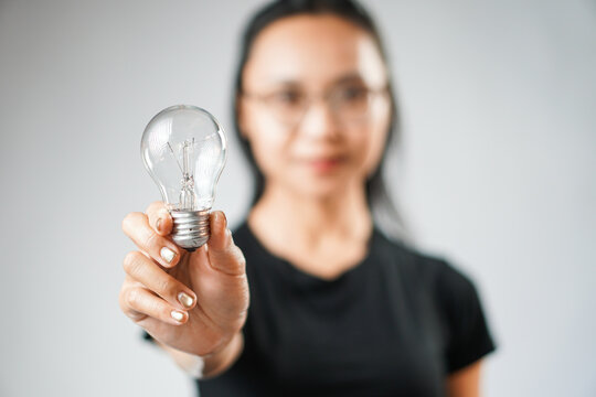 Woman holding light bulb for a new idea