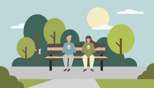 Young couple sitting on a wooden park bench while ignoring each other and focusing on their smartphones.