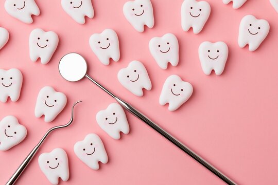 White cartoon teeth with smiles and dental tools