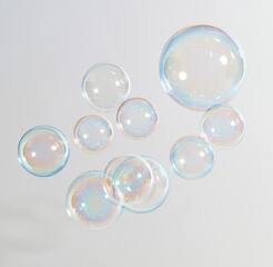 Obraz premium Colorful soap bubbles floating against white background