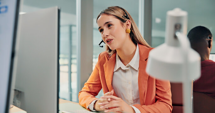 Call center, computer and agent in office with headset, customer care or helpline in tech support. Coworking, mic or woman with advisory, CRM service or online inquiry with system assistance.