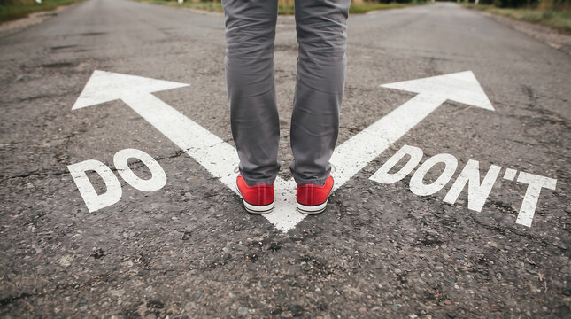 Person standing at a street fork between do and don't decision arrows.