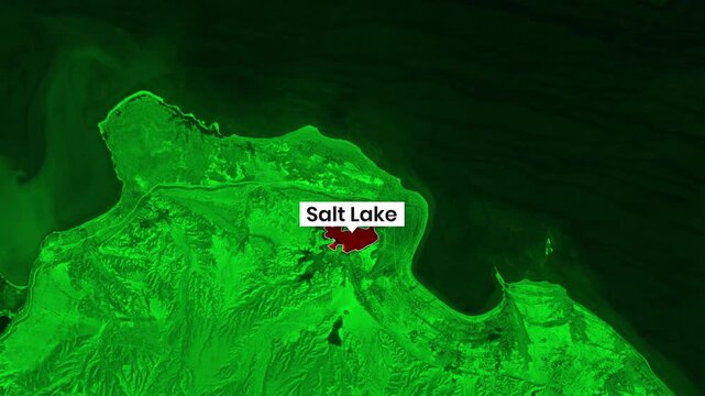 Animated satellite footage showing vast salt lake with surrounding green terrain