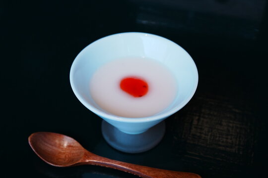 Annin tofu or almond jelly topped with strawberry sauce in a glass bowl, sweet dessert 