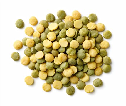 Green and yellow split peas scattered on white