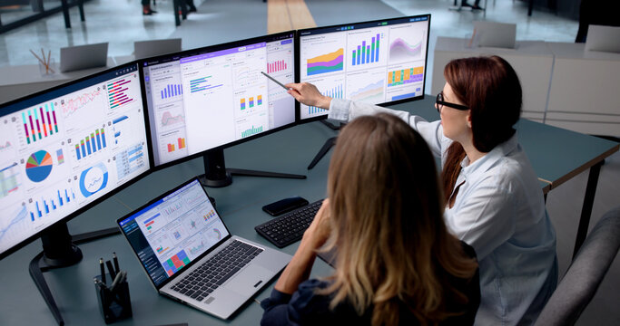 Woman Studies Financial Dashboard On Laptop, Sharing Insights