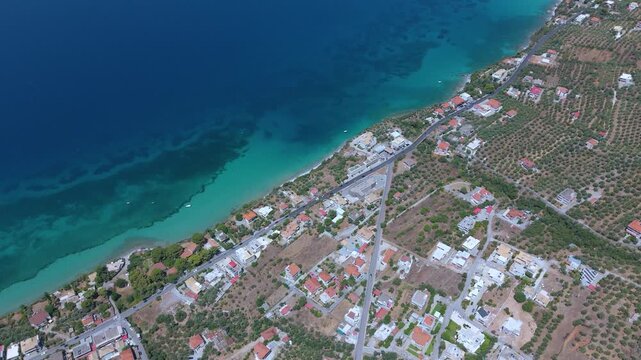 Aerial View of Coastal Road and Olive Groves Along Turquoise Sea in Verga, Kalamata, Greece