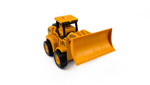 Kediri, East Java, Indonesia &ndash; August 26, 2026: Yellow Toy Bulldozer Model Displayed on White Background