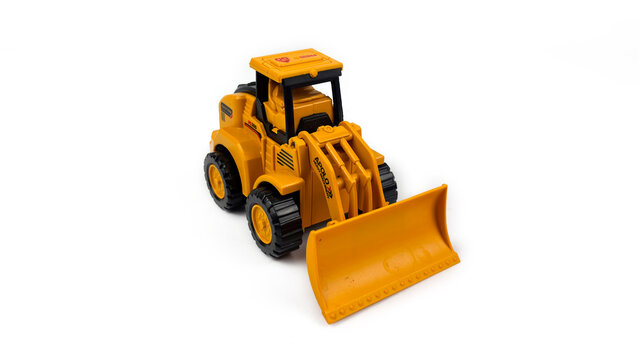 Kediri, East Java, Indonesia &ndash; August 26, 2026: Yellow Toy Bulldozer Model Displayed on White Background