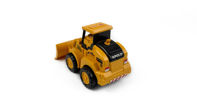 Kediri, East Java, Indonesia &ndash; August 26, 2026: Yellow Toy Bulldozer Model Displayed on White Background