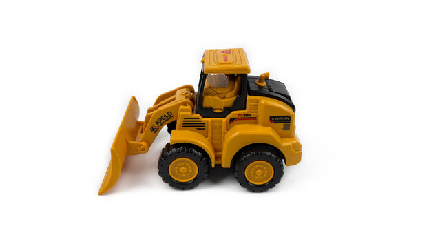 Kediri, East Java, Indonesia &ndash; August 26, 2026: Yellow Toy Bulldozer Model Displayed on White Background