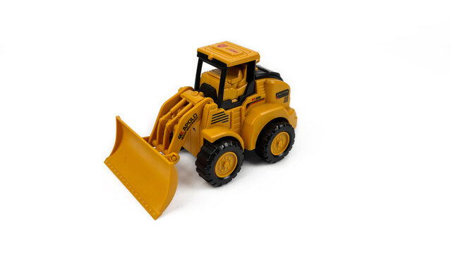 Kediri, East Java, Indonesia &ndash; August 26, 2026: Yellow Toy Bulldozer Model Displayed on White Background