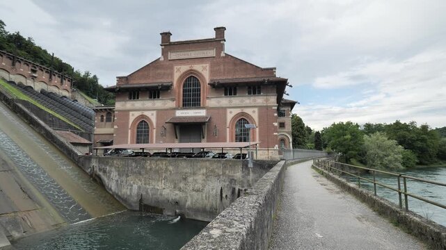 The old and historic hydroelectric power plant " Carlo Esterle", of 1914, on the river Adda. Lombardy, Italy.