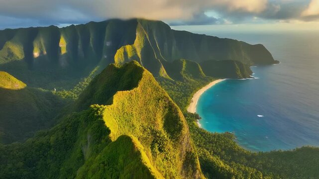 Aerial view of a lush green coastline with rugged mountains and turquoise waters.