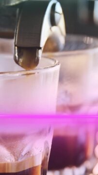Animation of light spots over man using coffee machine