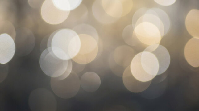 Abstract golden and white bokeh background with glowing light orbs