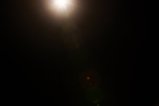 Sun flare on the black background