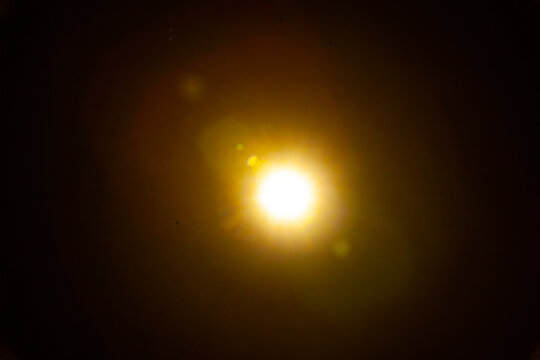 Sun flare on the black background