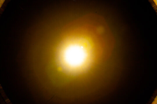 Sun flare on the black background