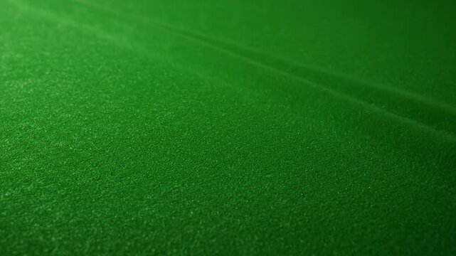 Dark green textured felt fabric surface with subtle gradient