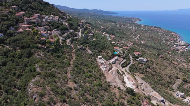 Drone Flight Over Hillside Village and Olive Groves Overlooking the Messenian Gulf in Verga, Greece