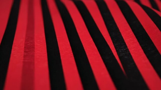 Vibrant red and black uneven vertical stripes abstract background