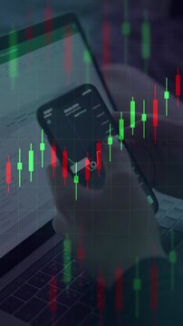 Person analyzing stock market or cryptocurrency on a smartphone and laptop. Overlaid with green and red candlestick charts representing trading.