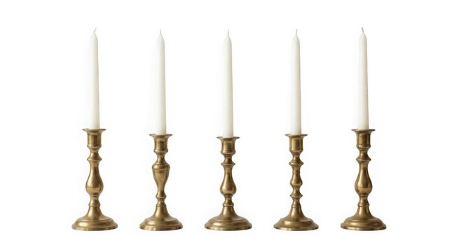Five brass candlesticks with white taper candles isolated on transparent background