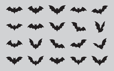 Fototapeta premium Collection of black bat silhouettes in various flying poses against a neutral background