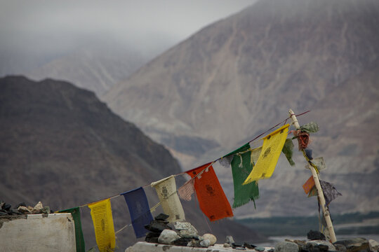 Traditional Buddhist prayer flags tied on rope in Nubra Valley Himalayas