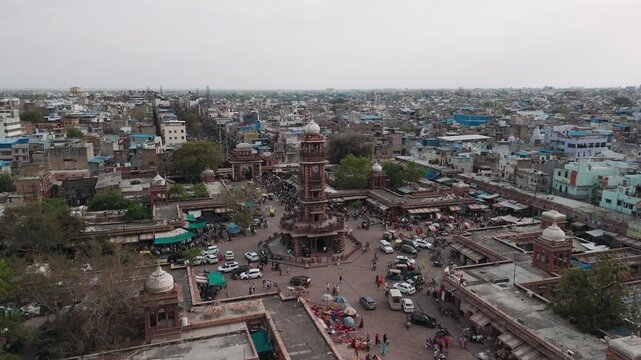 Aerial view of sardar market and ghanta ghar clock tower in the bustling city of jodhpur, india with traffic and pedestrians