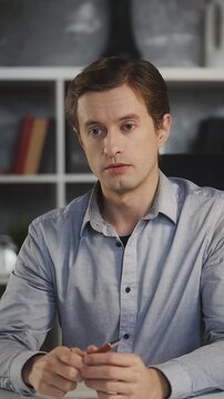 Male business analyst conducts online webinar, explaining company strategy