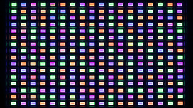 Vibrant digital LED screen pixel grid background featuring a colorful array of glowing electronic light diodes in a geometric pattern perfect for modern technology designs and displays