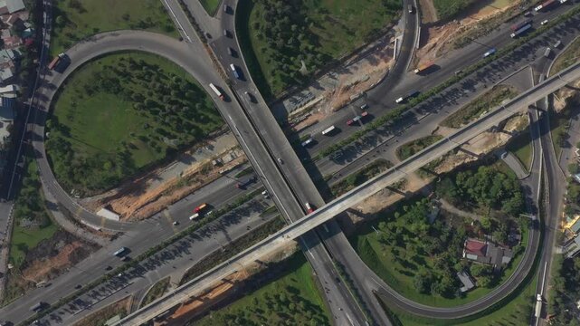 Aerial drone view of Tram 2 Interchange in Tang Nhon Phu Ward, Ho Chi Minh City, Vietnam, showing busy traffic at the intersection of National Highway 1A and the Eastern Ring Road.