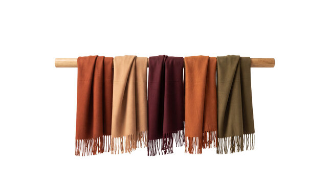 Autumn pashmina wool scarves on wooden rack, soft cashmere shawls in earth tones, winter fashion accessories for retail display