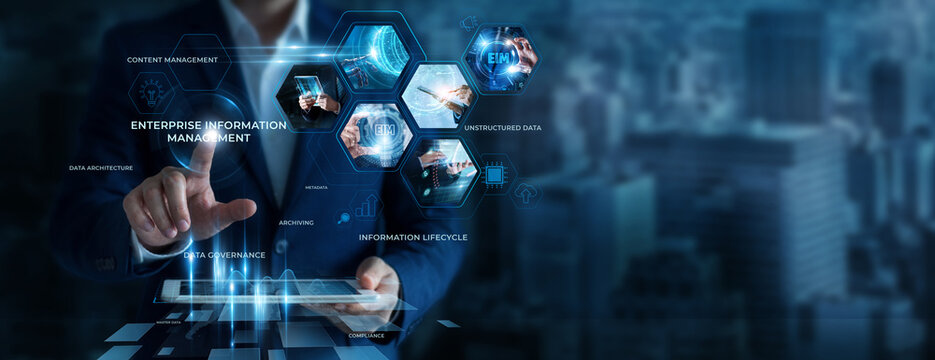 Businessman Using Tablet for Analyzing EIM Data. Managing business information, improving data organization, optimizing knowledge systems