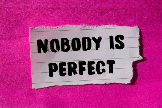 Nobody is Perfect message written on ripped torn paper background. Conceptual Nobody is Perfect symbol. Copy space.
