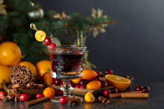 Christmas alcoholic drink with spices, cranberries, and citrus fruits.